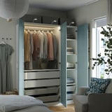 Open wardrobe with clothes, drawers, and shelves. Lights, mesh baskets, and folds easily.