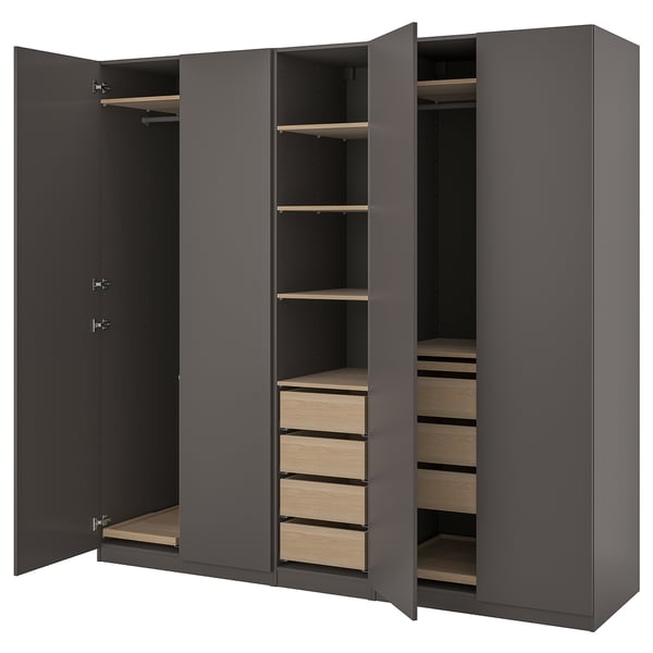 Modern grey wardrobe with four open doors revealing wooden shelves and drawers.