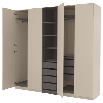 An open beige PAX wardrobe with shelves, drawers, and hanging space inside.