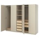 An open beige wardrobe named PAX. It shelving, drawers, and hanging space. The design is minimalist with a beige finish and wooden interior.
