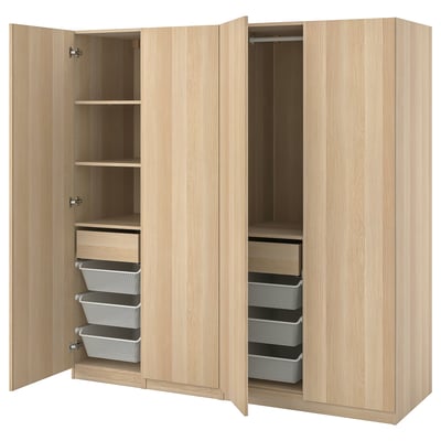 This image shows an open, light brown, wooden PAX wardrobe with shelves and mesh baskets inside.