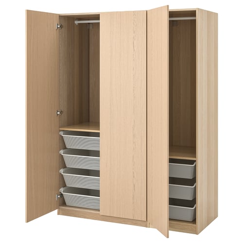 A light-colored wooden ikea PAX wardrobe with open doors and mesh baskets inside.