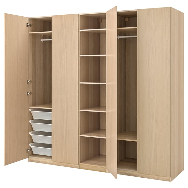 Light wood PAX wardrobe with shelves, hanging rails, and mesh baskets.