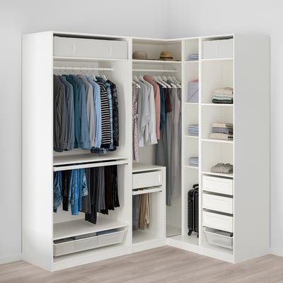A well-organized corner wardrobe with clothes on hangers, shelves, and storage drawers.