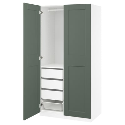 Modern PAX wardrobe with green doors, white interior, shelves, and drawers.