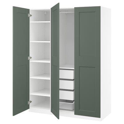 An open green PAX wardrobe, featuring shelves and organized compartments.