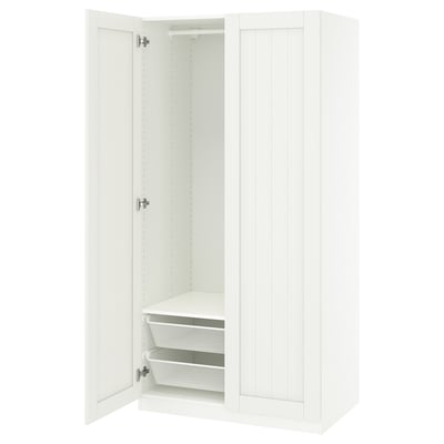 White PAX wardrobe, open door revealing shelves and basket inside.