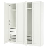 An open white PAX wardrobe with drawers and shelves.
