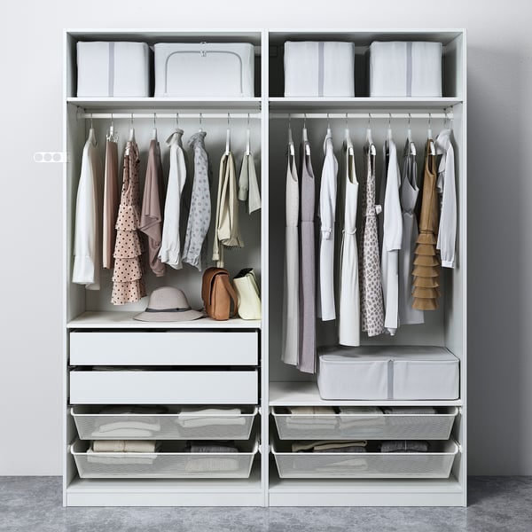Neat wardrobe with clothes, drawers, storage bins, and accessories organized inside.