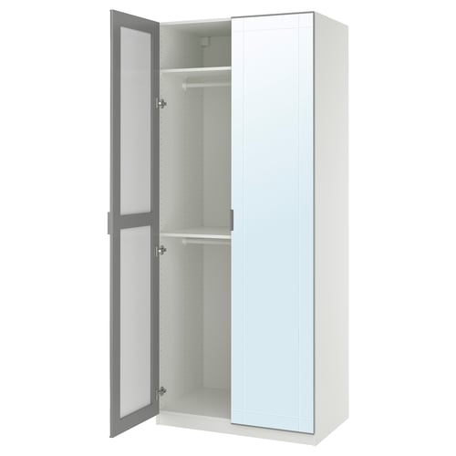 White PAX wardrobe with mirror door, grey frame, soft-close hinges, interior shelves.
