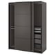 A dark grey ikea PAX wardrobe with sliding doors and shelves inside.