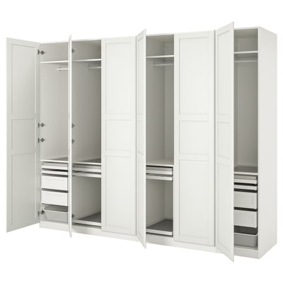 A white ikea PAX wardrobe with open doors, displaying storage shelves and compartments.