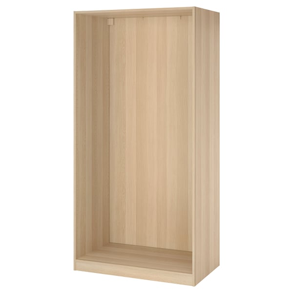 Empty oak PAX wardrobe frame, simple design, ready for assembly.