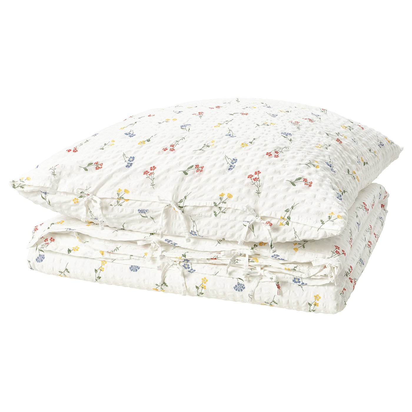 The PILDVÄRGMAL duvet set, white with colorful floral prints, a soft cotton-viscose blend and a seersucker texture.