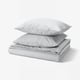 PILTANDVINGE grey bedding set, smooth fabric, includes duvet and pillowcases, minimalist design.