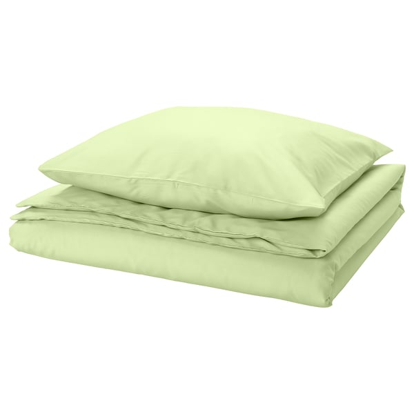 Light green bedsheet set, folded. Made from recycled polyester and viscose, smooth and wrinkle-free.