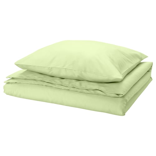Light green bedsheet set, folded. Made from recycled polyester and viscose, smooth and wrinkle-free.