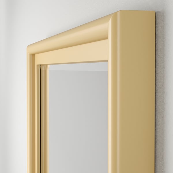 High-quality beveled edge mirror in sleek pine frame, mounted vertically for elegant decor.