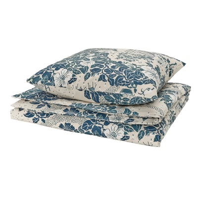 Folded floral bedding set, teal and white. Recycled cotton and lyocell. Elegant floral print.