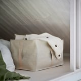 Beige fabric storage box with handles, part of PURRPINGLA series, organizes clothes & bedding, fits pax wardrobes, with ventilation.