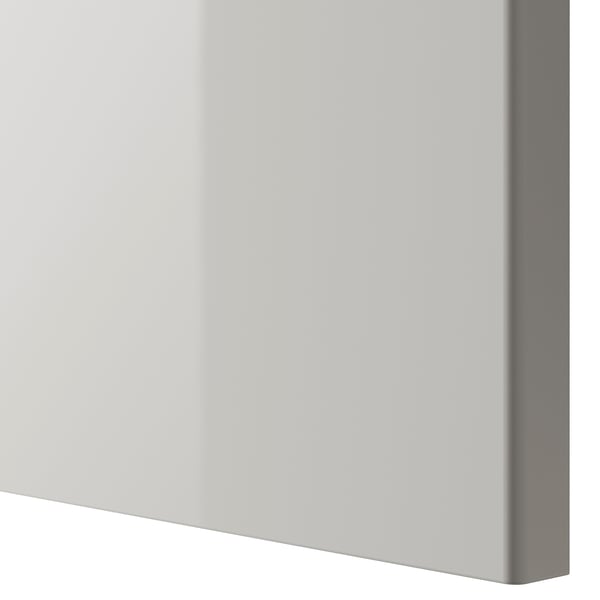Close-up of a high-gloss, clean kitchen cabinet door with a modern look.