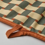 Checkered oven mitt, orange edges & loops, thick, earth-toned squares.