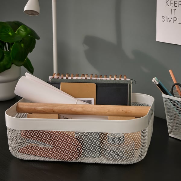 RISATORP white mesh desk organizer with wooden divider holds notebooks, papers, and pens, suitable for various spaces.