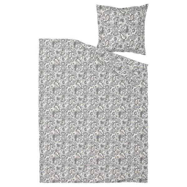 A rodgerasia duvet set featuring a black and white paisley pattern on natural-colored fabric, with a matching pillowcase.