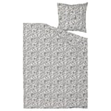 A rodgerasia duvet set featuring a black and white paisley pattern on natural-colored fabric, with a matching pillowcase.