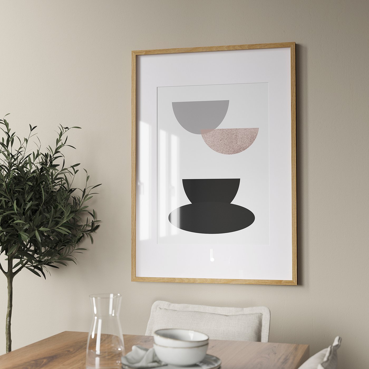 A framed abstract art print hangs above a wooden dining table with a pitcher and cutlery. A potted plant adds greenery.