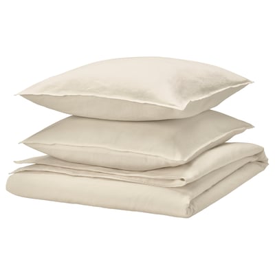 Beige bedding set, including duvet and pillows, made from soft cotton and linen, featuring a casual, wrinkle-chic design.