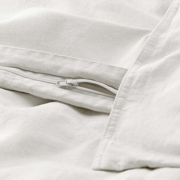 Linen-cotton duvet with zipper, slightly wrinkled, casual design.
