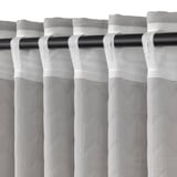 Curtain panel with rod loops, designed to block drafts and insulate windows, featuring pleated fabric for light control and privacy.