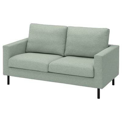 SALTSJÖBADEN loveseat sofa in light green fabric, modern minimalist design with clean lines and soft cushions.