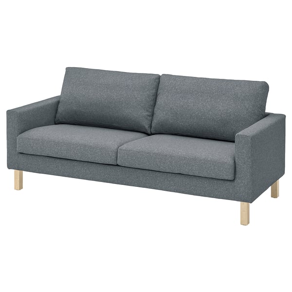 Dark grey modern sofa, sleek legs, comfortable cushions.