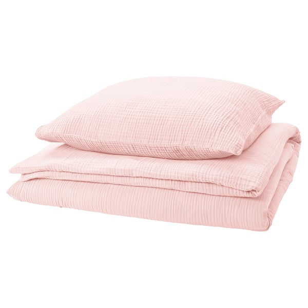 Light pink bedding set with textured design, folded neatly.