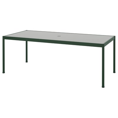SEGERÖN outdoor table: green metal frame, rectangular glass top, minimalist design.