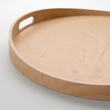Smooth, round birch tray with sturdy handles for easy carrying.