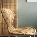 Woven rattan chair,ademirely crafted,shows natural texture & sturdy design.