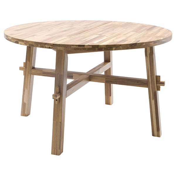 SKOGSTA: round dining table, natural acacia wood color, sturdy, light brown, four angled legs, simple design.