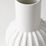 White glazed fluted vase.
