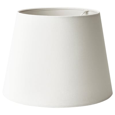 A white SKOTTORP lampshade. It is cylindrical with a simple, classic design, made from polyester and plastic.