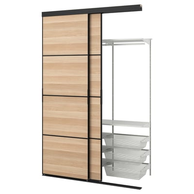 A SKYTTA wardrobe with a wooden sliding door and metal shelves, suitable for limited spaces.