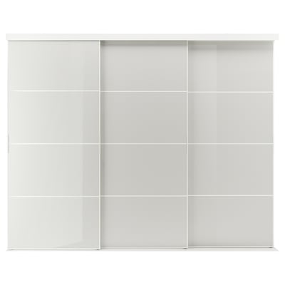 The SKYTTA is a sleek white sliding closet door system featuring a modern design with multiple glass panels framed in aluminum.