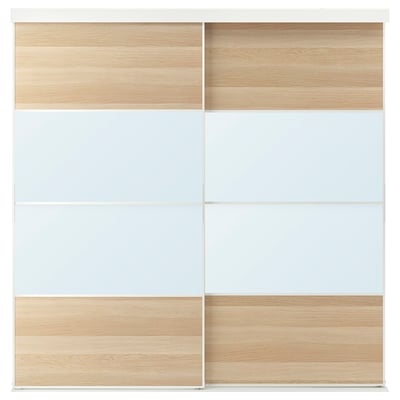 A SKYTTA sliding closet door in light wood and white. It sleek, modern design with mirror panels and wooden accents.