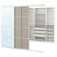 Displays a white SKYTTA wardrobe with sliding doors, featuring shelves and drawers for storage.