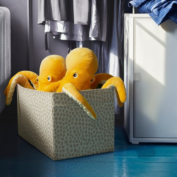 Boxy toy storage, colorful stuffed octopuses poking out, removable for play.