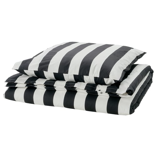 A folded black and white striped bedding set.