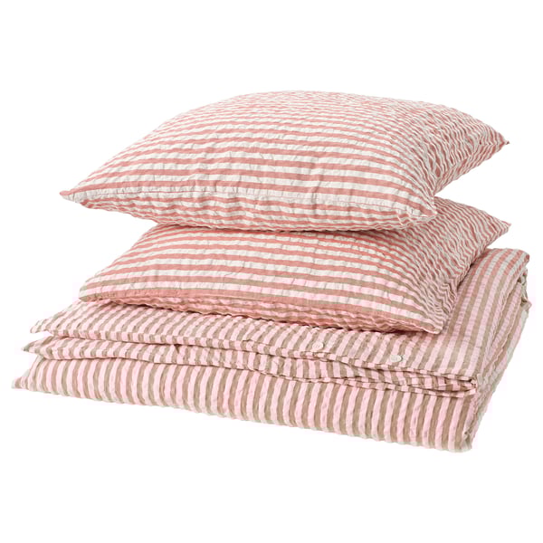 A stack of red and white striped bed linens, including a duvet cover and pillowcases, made of a cotton/viscose blend.