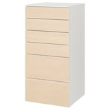A white ikea SMÅSTAD chest with six light wooden drawers, designed for baby or childs clothes storage.